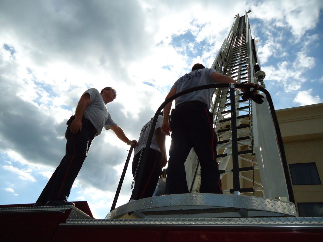 Crane Reaching up to Building