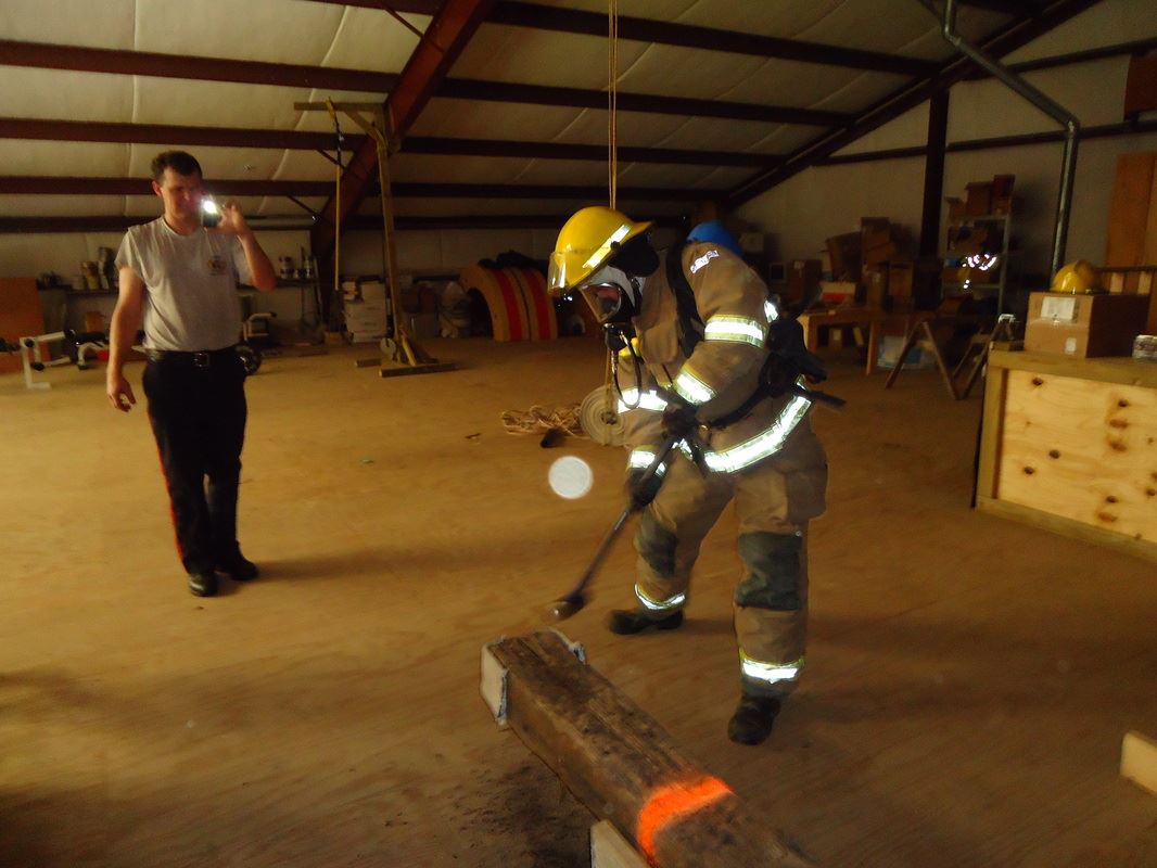 Person Performing And One Person Taking Pictures